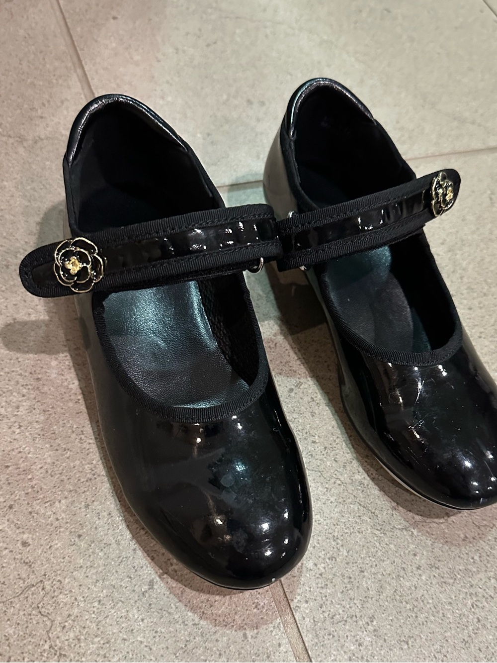 Girls Black Patent Tap Dress Shoes with Floral Accent’s Strap